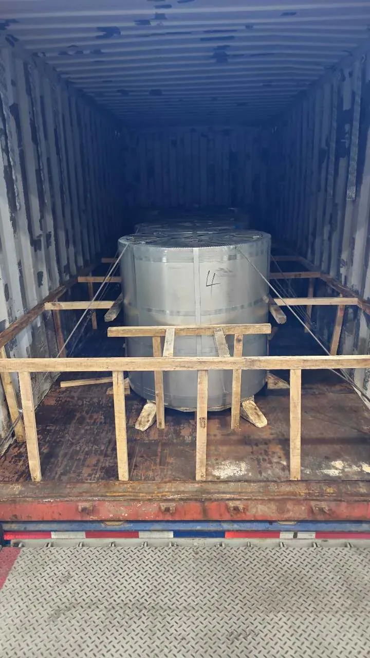 Steel coil arriving in a 20-foot ocean container, braced for transport